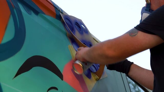 international artist day.graffiti artist taking out the drawing template and see how it turned out