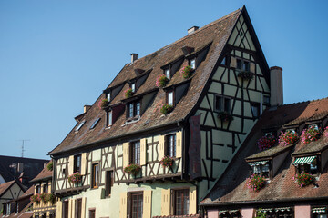 View of hotel sign on medieval building face in the street in Colmar - France