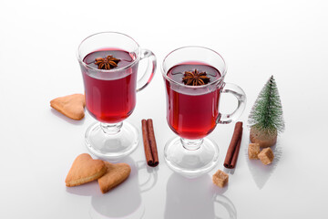 Hot red mulled wine isolated on white background with christmas spices