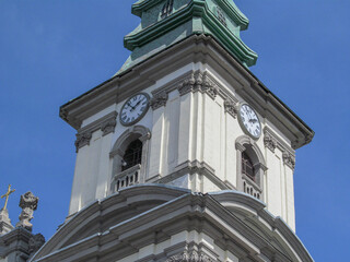 Clock on the tower of the old church in Ternopil