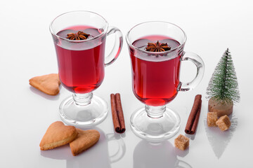 Hot red mulled wine isolated on white background with christmas spices