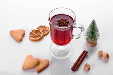 Hot red mulled wine isolated on white background with christmas spices
