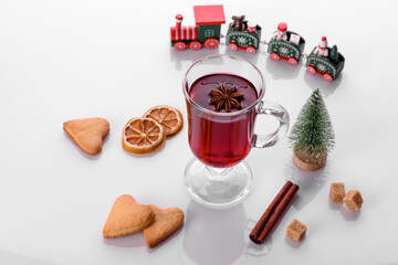 Hot red mulled wine isolated on white background with christmas spices