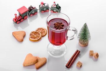 Hot red mulled wine isolated on white background with christmas spices