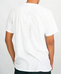 t-shirt mockup in white color. a man wearing a t-shirt for a mockup clothing catalog. mockup graphic from the back view.