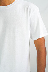 t-shirt mockup in white color. a man wearing a t-shirt for a mockup clothing catalog. mockup graphic from the front view.