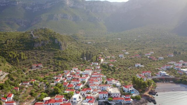 4k drone flight back footage (Ultra High Definition) of Paralia village. Gorgeous summer scene of Peloponnese peninsula, Greece, Europe. Traveling concept background..