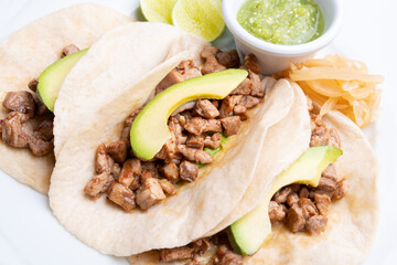 Grilled tacos with corn tortillas. Mexican food. Mexican food concept on wooden table. Traditional...