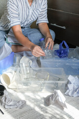 Garbage Sorting garbage onto glass, sheets and paper at home Garbage recycling, pollution proof, anti plastic, Zero waste, eco friendly Deliberate sorting of garbage