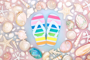 Vacation time at the beach summer concept with rainbow coloured flip flops,  collection of...