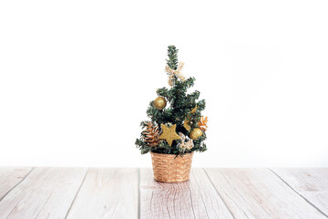 Cute little Christmas tree on wooden table