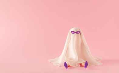 Girl in  ghost costume with purple sunglasses and high heels against pink background. Minimal Halloween funny party concept.