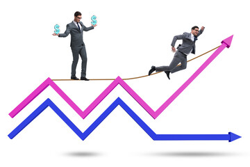 Businessman balancing on tightrope on line chart