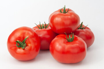 bunches of tomatoes on a white background