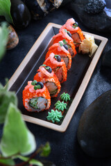 California rolls with shrimp.Traditional Japanese food.Rolls with shrimp,tobiko caviar and cucumber.Healthy food. Restaurant menu concept.Vertical photo.Top view.