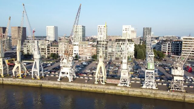 Drone footage of Antwerp old historical cranes in lovely afternoon light