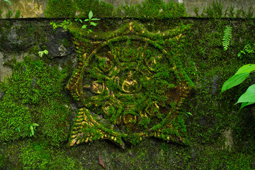 stone pattern in the form of a mossy symbol during the royal era in Indonesia.