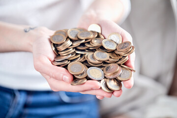 euro coins in the hands