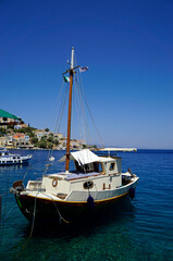 Naklejka na ściany i meble small boat in the harbor of symi