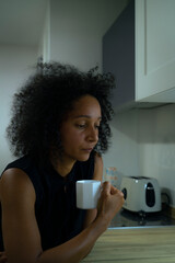Colombian woman tasting fresh coffee