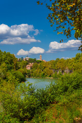 Fototapeta na wymiar Nature in Rome. View of the city old historic center from River Tiber embankment full of trees