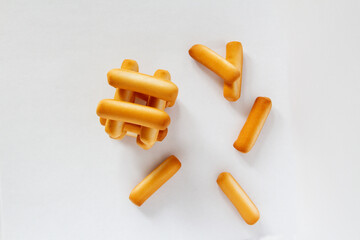 A machine made of cookies sticks on a white background viem over