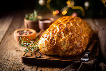 Perfect homemade juicy Beef Wellington, tenderloin dish on rustic wooden table