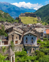Fototapeta na wymiar The picturesque village of Exilles and its fortress, in the Susa Valley. Province of Turin, Piedmont, northern Italy.