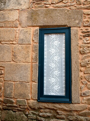 Traditional window with lace curtain in Castelo Rodrigo