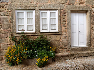 Fototapeta na wymiar Castelo Rodrigo traditional stone house small windows and door