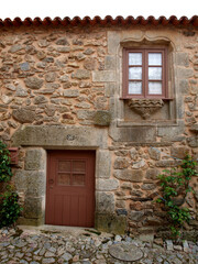 Fototapeta na wymiar Castelo Rodrigo traditional stone house small window and door