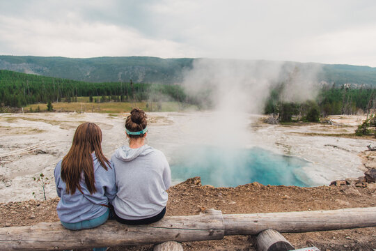 Family Looking At Blue Hot Spring Yellowstone