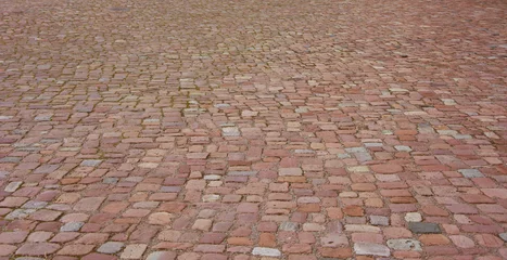 Foto op Plexiglas Old cobblestone pavement. Stone vintage paved road © Julia