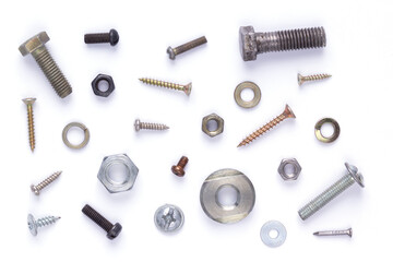 Set of old metal screw, bolt head, nut, washer and nail tool at white background