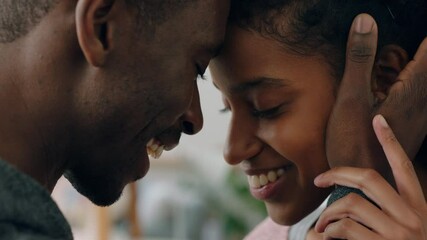 happy young mixed race couple enjoying romantic relationship boyfriend touching girlfriends face with gentle caress sharing love partners feeling intimate connection 4k