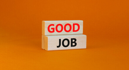 Good job symbol. Concept words 'good job' on wooden blocks on a beautiful orange background. Business and good job concept, copy space.