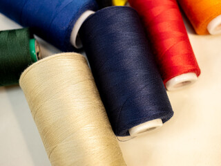 reels with bright threads for sewing