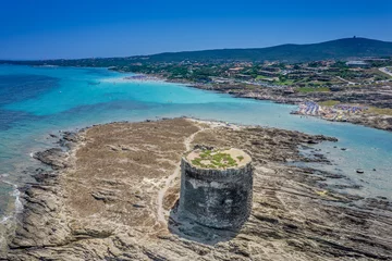 Fotobehang La Pelosa Strand, Sardinië, Italië Aerial view of nuraghe in a island in Mediterranean sea next to Sardinia coast