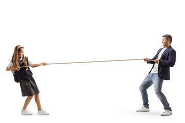 Full length profile shot of a little girl and a man pulling a rope