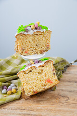 Cut Easter cake made from yeast dough, decorated with edible moss