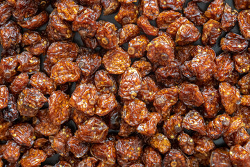 texture background: Dried physalis peruviana fruits also known as cape gooseberry or goldenberry top view.