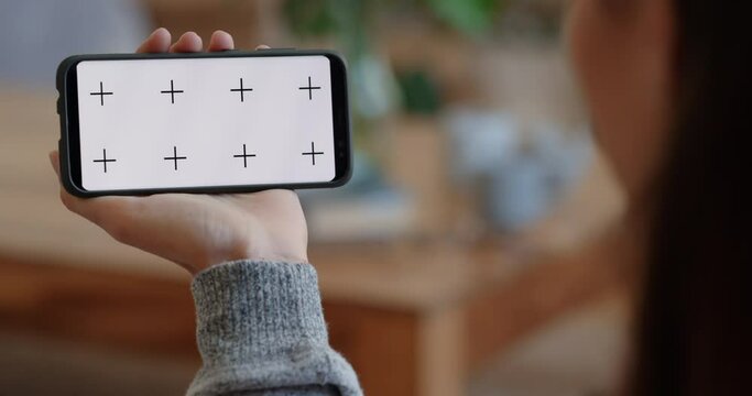 woman using smartphone having video chat waving at friend on green screen enjoying mobile phone communication display in horizontal orientation track matte 4k