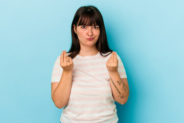 Young curvy caucasian woman isolated on blue background showing that she has no money.