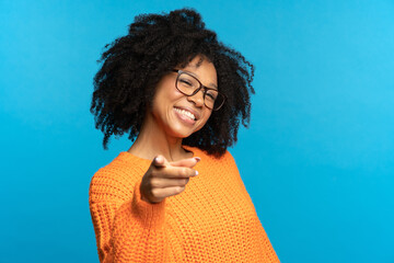 It's you. Joyful african american girl point finger at you happy smiling. Black student female in...