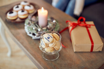 Close-up of table with traditional Hanukkah decorations.