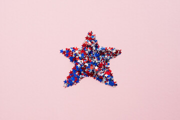 American flag confetti star on pink background. Flat lay, top view. USA Independence Day, Veterans...