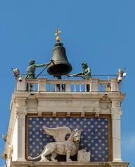 Venice, Clock and bell tower in Renaissance style in San Marco square with the statues called Mori...