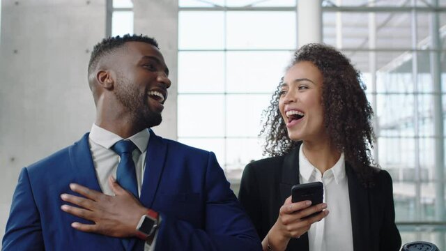 businessman executive chatting to personal assistant instructing intern woman using smartphone taking notes planning meetings for manager discussing work sharing ideas walking in office lobby