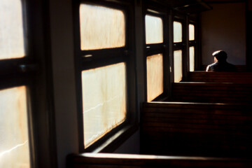 Obraz na płótnie Canvas Old man on train. Lonely passenger at window. Railroad trip