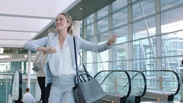 happy business woman dancing funny victory dance celebrating in corporate office enjoying successful career promotion excited female executive having fun winning 4k